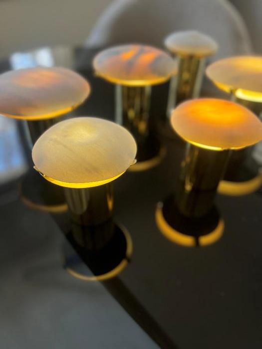 Group view of Green Pepe lamps glowing